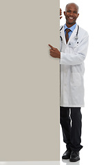 Image showing Placard, black man and portrait of doctor point at poster mockup, hospital services or health information. Studio space, cardboard banner and healthcare worker for medical support on white background