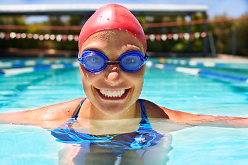 Image showing Sports, portrait or happy woman in swimming pool for competition training, workout or energy. Face, practice and cardio with female swimmer, goggles and athlete for exercise, wellness or fitness