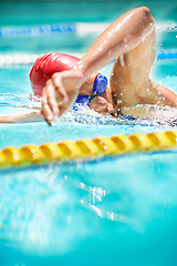 Image showing Sports, stroke or person in swimming pool for competition training, cardio workout or fitness. Energy, water splash and fast swimmer and athlete for exercise, championship and race at gala with speed