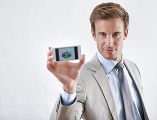 Image showing Business man, phone screen and data, statistics or pie chart for financial report, revenue and stock market. Portrait of corporate accountant on mobile for trading or sales on a white wall background