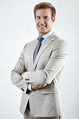 Image showing Portrait, happy and business man with arms crossed for pride in corporate career. Smile, confident professional lawyer and attorney worker in suit isolated on a white studio background in Australia