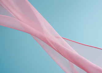 Image showing Flying pink fabric wave isolated on blue background