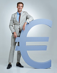 Image showing Portrait, Euro currency symbol and man with business, finance and investor on a grey studio background. Person, employee and model with accountant, trader and stock market with economy, emoji or icon