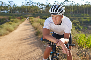 Image showing Man, cyclist and mountain bicycle for resting, training and energy for rider, thinking and sport. Outdoor, hobby and fitness in nature, trail and active for wellness, helmet and physical workout