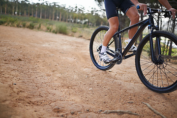 Image showing Person, legs and mountain bike for cycling fitness on nature path for health challenge, performance or extreme sport. Athlete, exercise and off road dirt terrain or adventure, wellness or competition