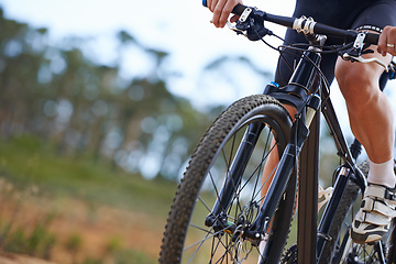 Image showing Hands, bicycle and gear in nature for cycling adventure on off road terrain for extreme sport, performance or cardio. Person, fingers and shifter on mountain gravel or racing, competition or training