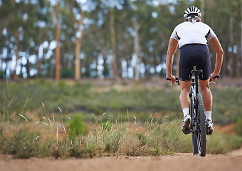 Image showing Person, mountain bike and forest fitness for sports training in countryside for adventure, performance or workout. Cyclist, transportation and off road terrain for challenge, competition or back view