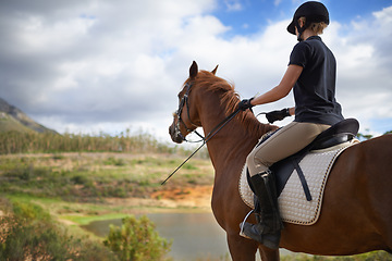 Image showing Equestrian, horse and woman riding in nature on adventure and journey in countryside. Ranch, animal and rider outdoor with hobby, sport or walking a pet on farm with girl in summer at river in woods