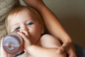 Image showing Relax, portrait and baby drinking bottle and laying with mother for nap time with refreshing tea. Cute, sweet and infant, kid or toddler enjoying beverage for nutrition, health and child development.