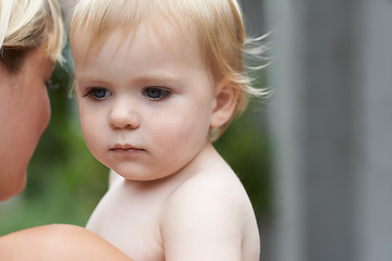 Image showing Baby, face and mother outdoor for development with love, curiosity or early childhood in backyard of home. Toddler, child and relax for wellness, milestone and exploring or innocent and bonding