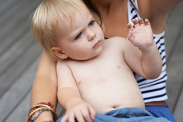 Image showing Baby, face and mother outdoor for development with love, curiosity or early childhood in backyard of home. Toddler, child and relax for wellness, milestone and exploring with embrace and bonding