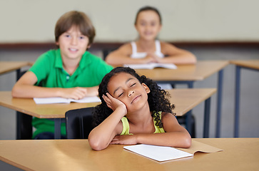 Image showing Sleepy, children and bored of learning, education or books from adhd, burnout or frustrated with mindset in school. Exhausted, girl or thinking of studying, group or problem with fatigue in classroom