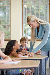 Image showing Teacher, girl and students in classroom for education, learning and writing or language development with support. Happy woman and children for teaching, helping with knowledge and questions at school