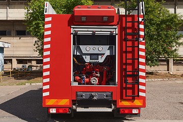 Image showing Close-up of essential firefighting equipment on a modern firetruck, showcasing tools and gear ready for emergency response to hazardous fire situations