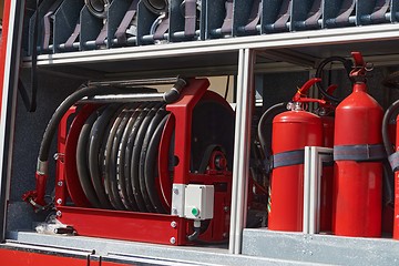 Image showing Close-up of essential firefighting equipment on a modern firetruck, showcasing tools and gear ready for emergency response to hazardous fire situations