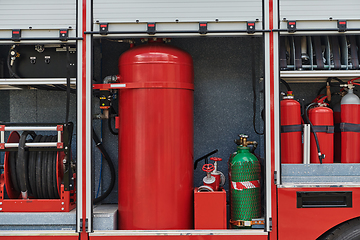 Image showing Close-up of essential firefighting equipment on a modern firetruck, showcasing tools and gear ready for emergency response to hazardous fire situations