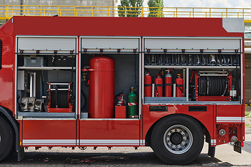 Image showing Close-up of essential firefighting equipment on a modern firetruck, showcasing tools and gear ready for emergency response to hazardous fire situations