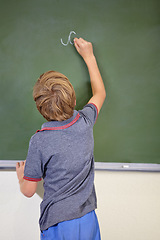 Image showing Child, chalkboard and school writing with education, cursive and answer for learning. Back, knowledge and kid development in a study lesson with student in a classroom with chalk and solution