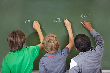 Image showing Children, chalkboard and school writing with education, cursive and answer for learning. Back, knowledge and youth development in a study lesson with students in classroom with chalk and solution