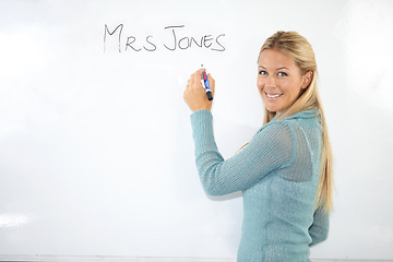 Image showing Happy woman, teacher portrait or writing on whiteboard for education, learning or teaching. Smile of a young professor, lecturer or class educator with name in classroom for middle school knowledge