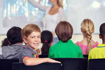 Image showing Portrait, boy or happy student in classroom for knowledge, education or development for future growth. Smile, back to school or child in chair for studying, listening or fun learning for scholarship