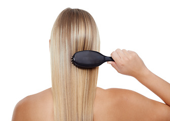 Image showing Woman, back and brushing hair for grooming, texture or salon treatment on a white studio background. Rear view of female person, model or blonde with brush for haircare, keratin or shine on mockup