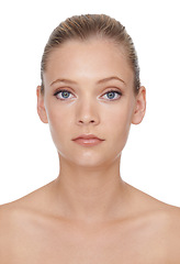 Image showing Woman, portrait or beauty with cosmetics in studio for glowing face, wellness and dermatology or serious. Model, person or confidence with skincare, collagen or makeup on white background and topless