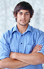 Image showing Portrait, arms folded and man with confidence in career and wellness in studio background. Person, pride and face of entrepreneur in ambition in start up company and it professional in silicon valley