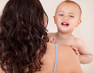 Image showing Mom, baby and hug crying child in home with sad face from fatigue, exhaustion or upset tantrum. Toddler, kid and mother support son in arms with love, kindness and embrace with care and comfort