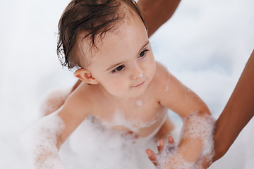 Image showing Baby, hygiene and water for washing in bathroom, bath and cleaning for skincare at home. Person, toddler and childcare or healthy skin and body care for wellness, cosmetics and soap foam or liquid