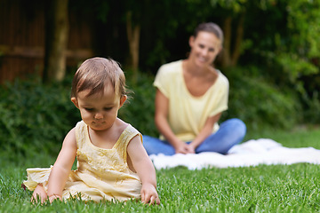 Image showing Mother, baby and playing together in outdoors for bonding, love and affection or curious in childhood. Mom, toddler and happy girl or child and relaxing outside, learning and security in relationship