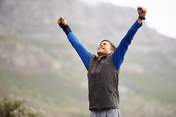 Image showing Man, fitness and victory on mountain, happy and winner for achievement, exercise and workout. Success, fitness and climber for training, winner and nature to explore, hobby or health for celebration