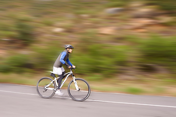 Image showing Man, mountain bike and cycling on road in speed for nature adventure or outdoor extreme sports. Male person or cyclist on bicycle for cardio, street or downhill in motion blur, exercise or practice