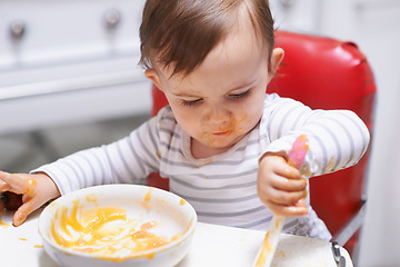 Image showing Eating, vitamins and boy baby in chair with vegetable food for child development at home. Organic, nutrition and sweet hungry kid or toddler enjoying healthy lunch, dinner or supper meal at house.