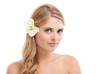 Image showing Woman, portrait and smile in studio with flower, confidence and pride for cosmetic treatment. Model, person or face with mockup for haircare or aesthetic with organic skincare on white background