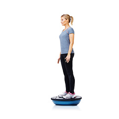 Image showing Woman, ball and fitness for balance, exercise or workout on a white studio background. Young active female person or athlete standing on half round object for health and wellness on mockup space