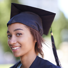 Image showing Woman, portrait with graduate and achievement with education, cap and gown for ceremony outdoor. College, smile and graduation event for academic success, higher learning and certification with pride