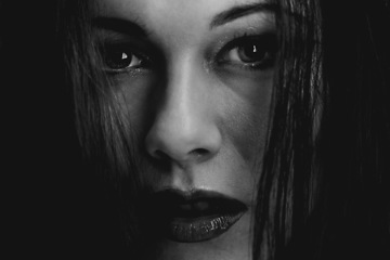 Image showing Woman, beauty and monochrome makeup in portrait, cosmetics and edgy style by dark background. Female person, face and skincare or haircare in studio, black and white aesthetic or closeup by backdrop