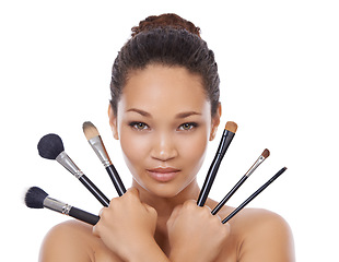 Image showing Woman, portrait and makeup brushes for cosmetics in studio, choice and decision for beauty. Female model person, tools and equipment for application, skincare and facial treatment by white background