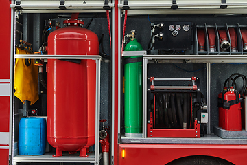 Image showing Close-up of essential firefighting equipment on a modern firetruck, showcasing tools and gear ready for emergency response to hazardous fire situations