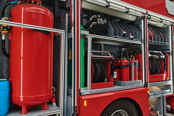 Image showing Close-up of essential firefighting equipment on a modern firetruck, showcasing tools and gear ready for emergency response to hazardous fire situations