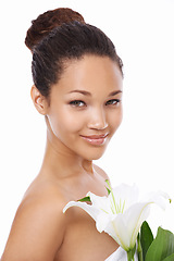 Image showing Woman, portrait and flower skincare or smiling, studio and happy with facial treatment by white background. Female person, face and wellness or cosmetics and dermatology, beauty and luxury or organic