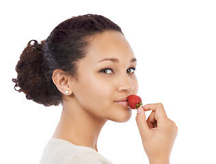 Image showing Portrait, face of woman and eating strawberry in studio for health, vegan diet and nutrition on white background. Model, red berries and sustainable benefits of detox food, vitamin c and sweet fruits