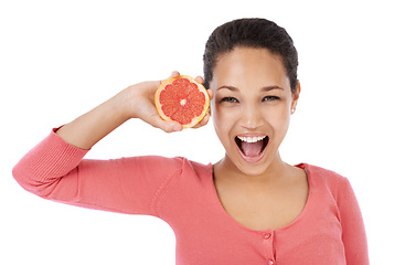 Image showing Portrait, woman and excited with grapefruit for healthy detox, vegan diet and eco nutrition in studio on white background. Model, fruits and smile for sustainable benefits of vitamin c in citrus food