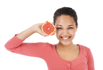 Image showing Portrait, woman and smile with grapefruit for healthy detox, vegan diet or eco nutrition in studio on white background. Happy model, fruits and sustainable benefits of vitamin c, snack or citrus food