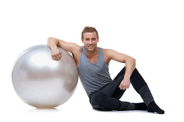 Image showing Relax, fitness and medicine ball with portrait of man in studio for exercise, yoga and aerobics workout. Health, gym and pilates with person on white background for wellness, commitment and vitality