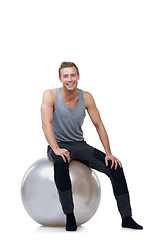 Image showing Smile, fitness and medicine ball with portrait of man in studio for exercise, yoga and aerobics workout. Health, gym and pilates with person on white background for wellness, commitment and vitality