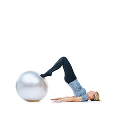 Image showing Woman, ball or stretching on a white background space for workout, wellness or mobility exercise. Female athlete training, core or fitness for mockup, stretching legs or body flexibility in studio