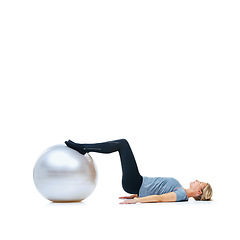 Image showing Woman, fitness and exercise ball for training, workout or health and wellness against a white studio background. Active female person or athlete on round object, gym floor or pilates on mockup space