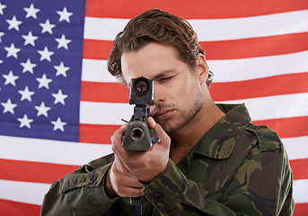 Image showing Military, aim and gun with portrait of man shooting in studio for war, conflict and patriotic. Army, surveillance and security with person on usa flag for soldier, battlefield and American veteran